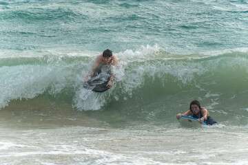 boogie boarding at Poipu beach 