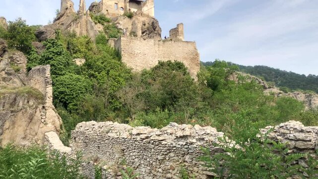 Ruins of an old European castle. View of tourists walking around Durnstein Castle. Durnstein. Wachau valley, Austria.