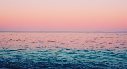 Fototapeta premium Ocean Wave at Sunset with Pink Sky and Calming Blue Water