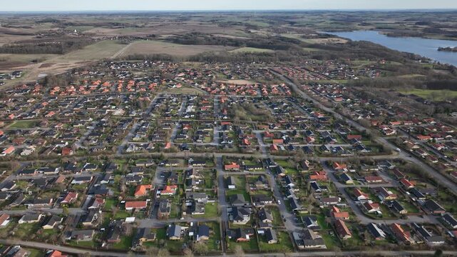 Reversing aerial view of homes in Skanderborg
