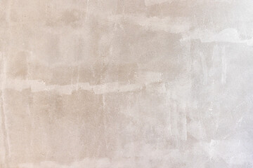 Prime oil based primer on old concrete wall before applying the main color.  renovation concept.