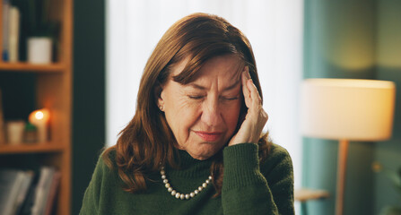 Senior, woman or pain from headache in home with stress, frustrated or confused from brain fog in...