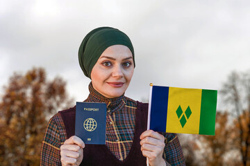 Muslim Woman Holding Passport and Flag of Saint Vincent and the Grenadines