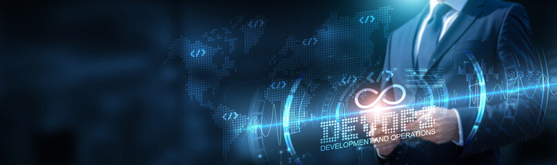 DevOps. A businessman using a tablet on a global network connection on cloud services and IoT with big data and development of DevOps (development and operations). Technology and software solutions.