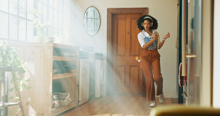 Headphones, woman or dancing to radio in home for weekend break, audio playlist or streaming sound. Energy, African person or celebration with album track, listening to music or podcast with sunlight