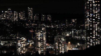 Skyline of Brentwood by night as seen from Capitol Hill during a December in Burnaby, British Columbia, Canada