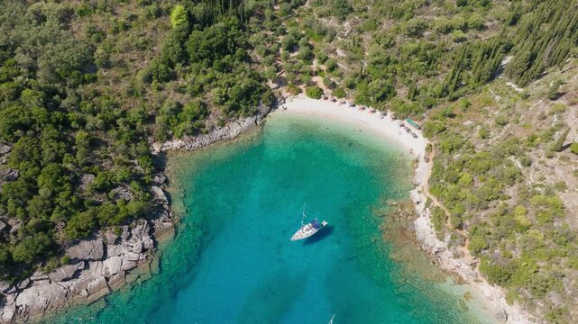 Slow panning drone shot of Filiatro beach in Ithaca Island, Greece during summer