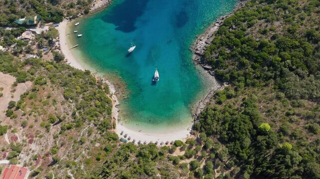 Slow panning drone shot of Sarakiniko beach, Ithaca island, Greece