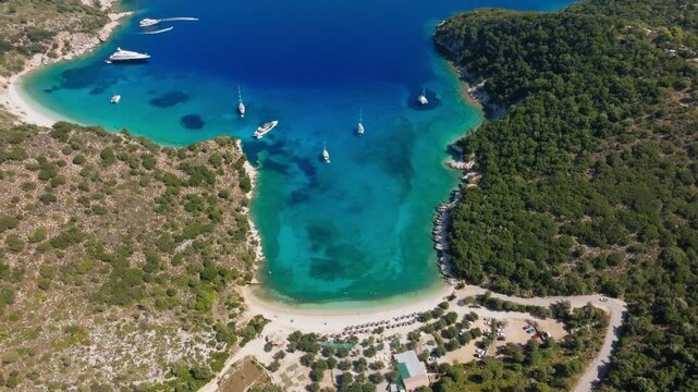 Slow panoramic pan shot of Filiatro secluded beach in Ithaca island, Greece