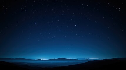 Starry night over misty mountains