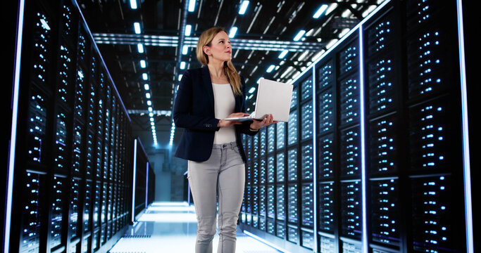 Smiling Woman Managing Data Center Server Room - Powered by Adobe