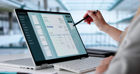 Focused Accountant Crunching Numbers On Laptop