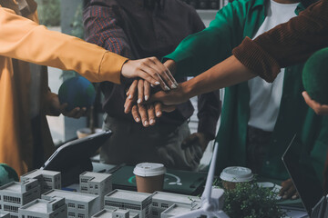 Asian business people team brainstorm meeting in green corporate office. Presentation ESG project planning. Environmental conservation, responsible business, sustainable development goal concept.