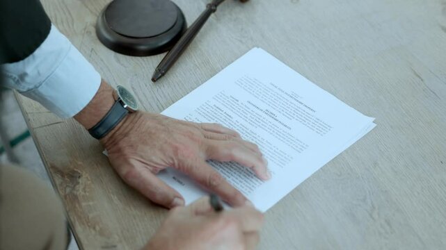 The judge signs the documents