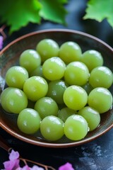 Japanese green grapes in caramel on ice cream at street sweet shop