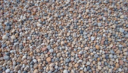 Obraz premium Close up photo of colorful round smooth pebbles arranged in a stone pattern texture.