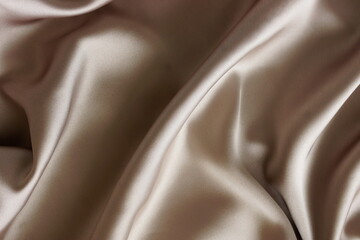 Silk texture brown color, abstract, drapery fabric, textile top view background template with copy...