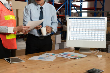 Accounting software on computer screen showing financial statement spreadsheets and account balance...