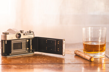 Open Film Camera with Drink and Tobacco