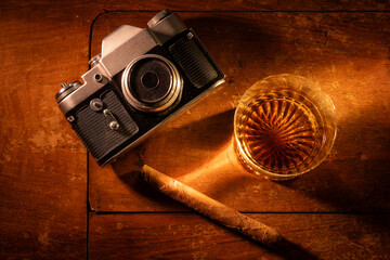 Nostalgic Still Life with Old Camera and Whiskey
