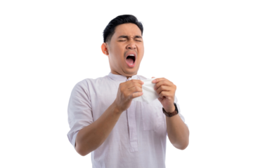 Unhealthy Asian Muslim man suffering flu-sick, sneezing loudly in tissue isolated on transparent background