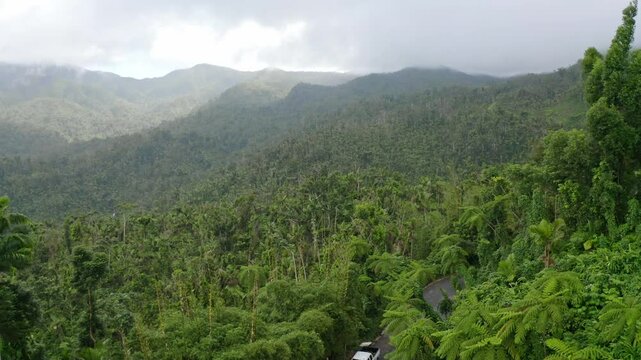 Ascending drone shot of the El Yunque National Forest in northeastern Puerto Rico during daytime