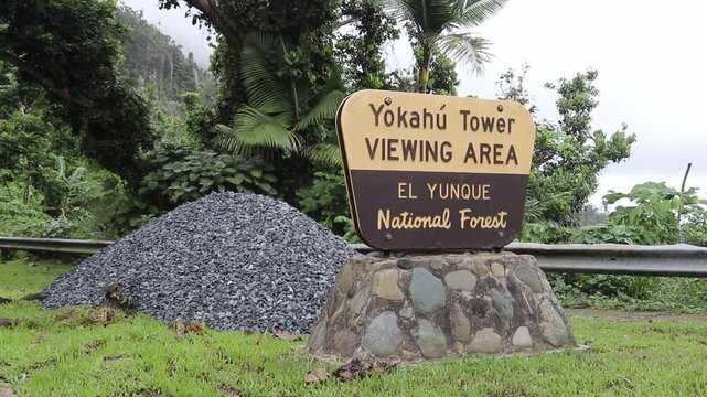 Sign of the Yokahu Tower viewing area in El Yunque National Forest, Puerto Rico, on a cloudy day