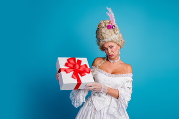 Elegant lady in vintage baroque attire holding a gift, blending antique charm and modern culture on a vibrant blue background