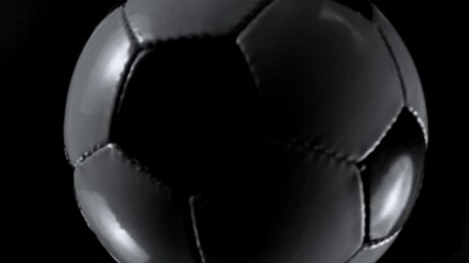Super slow motion of soccer ball falling into water , top down shot . Filmed on high speed cinema camera , 1000 fps - Powered by Adobe