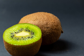 Kiwi fruit and black background