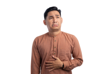 Handsome Asian Muslim man touching his stomach feels hungry and wants to eat delicious food isolated on transparent background
