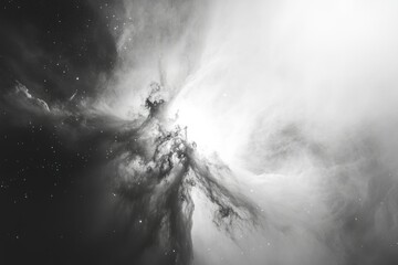 A grayscale cosmic landscape showcasing a nebula's ethereal beauty, with subtle light and dark contrasts.