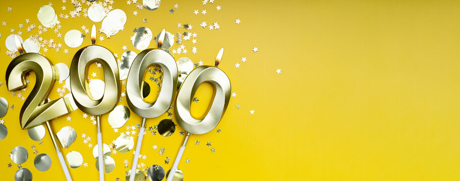 2K followers card. for social networks and blogs. Golden candles number two thousand on yellow background. followers card. 2000 online community fans and subscribers. banner. copy space