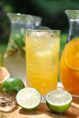 a glass of iced lemonade with lime and orange