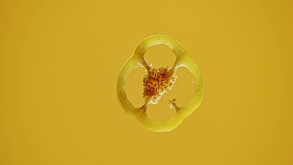 Yellow Pepper Slice Floating on Vibrant Yellow Background