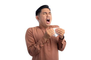 Unhealthy Asian Muslim man suffering flu-sick, sneezing loudly in tissue isolated on transparent background
