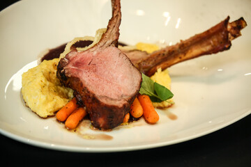 rack of lamb on the bone with mashed potatoes and carrots, dish, restaurant serving