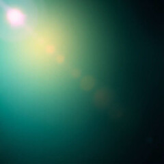 Fototapeta premium A smooth abstract gradient background blending deep green, teal, and blue tones with subtle fabric-like texture. The image features a bright lens flare cast upon a smooth bronze surface, exhibiting .