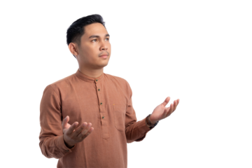 Religious Asian Muslim man praying with raised hands isolated on transparent background. Ramadan and Eid Fitr celebration concept