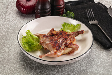 Grilled quail in the plate