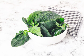 Ripe green spinach leaves heap