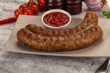 Grilled beef sausages with sauce