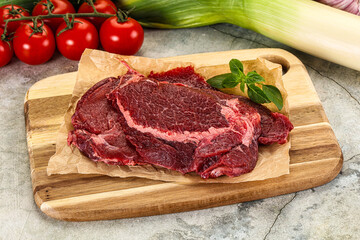 Raw beef cheeks cut for cooking