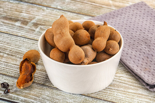 Tropical exotic Tamarind fruit heap