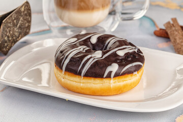 Delicous sweet donut with chocolate glaze