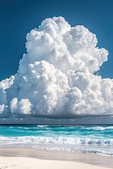 Serene beach vista with turquoise water gentle waves white sand and a massive cumulus cloud formation against a clear blue sky