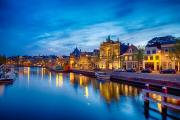Travel View of Harlem Sight on Spaarne River On The Background At Twilight.