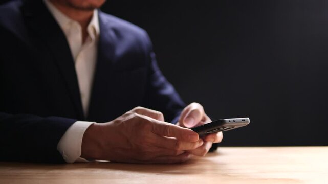 Businessman using mobile smartphone finger touching on phone screen, mobile banking, online shopping, social media, chatting with AI, customer support. Concept of technology, digital communication