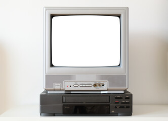 Old silver vintage TV with white screen and VCR from 1980s, 1990s, 2000s isolated on white...
