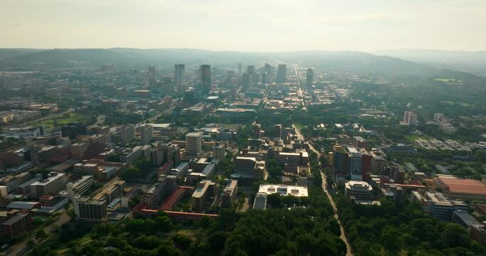 Aerial view of Pretoria Downtown Skyline with Central District and infrastructure. Urban cityscape for business and travel visuals. 4K drone zoom in video of administrative capital of South Africa